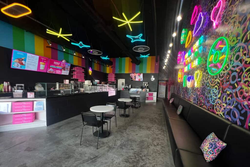 Colorful, neon, donut/ice cream/coffee shop with ocean view on the jersey shore boardwalk