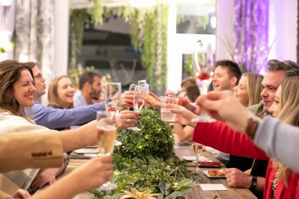 people toasting at a dinner party 