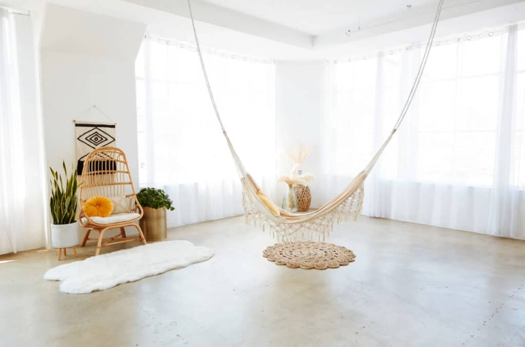 a bright white studio with boho decor