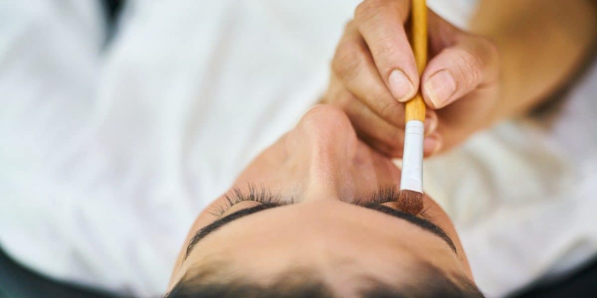 makeup artist applying cosmetics
