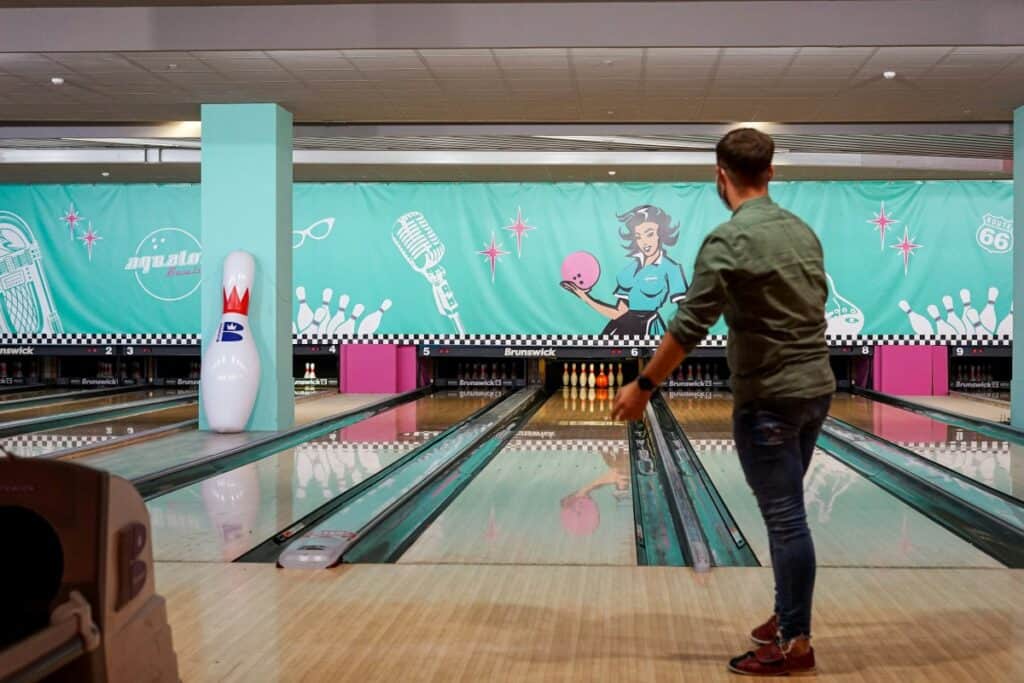 a man bowling at an alley