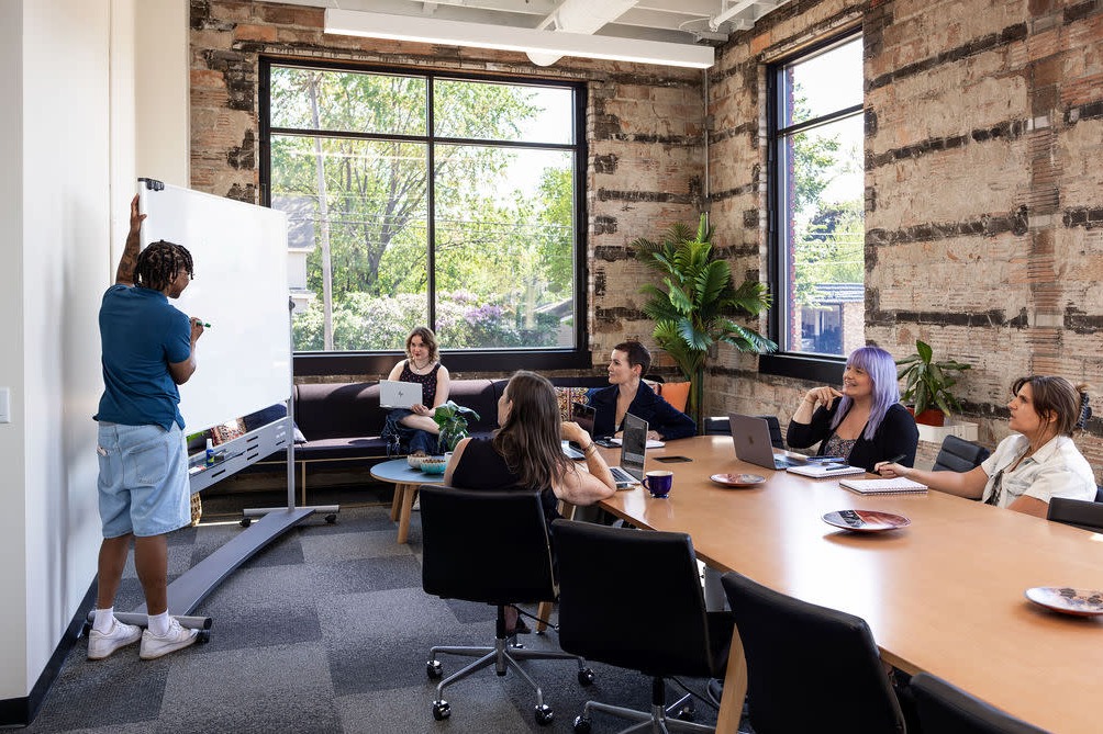 Atlanta meeting planners reviewing event details at a downtown venue