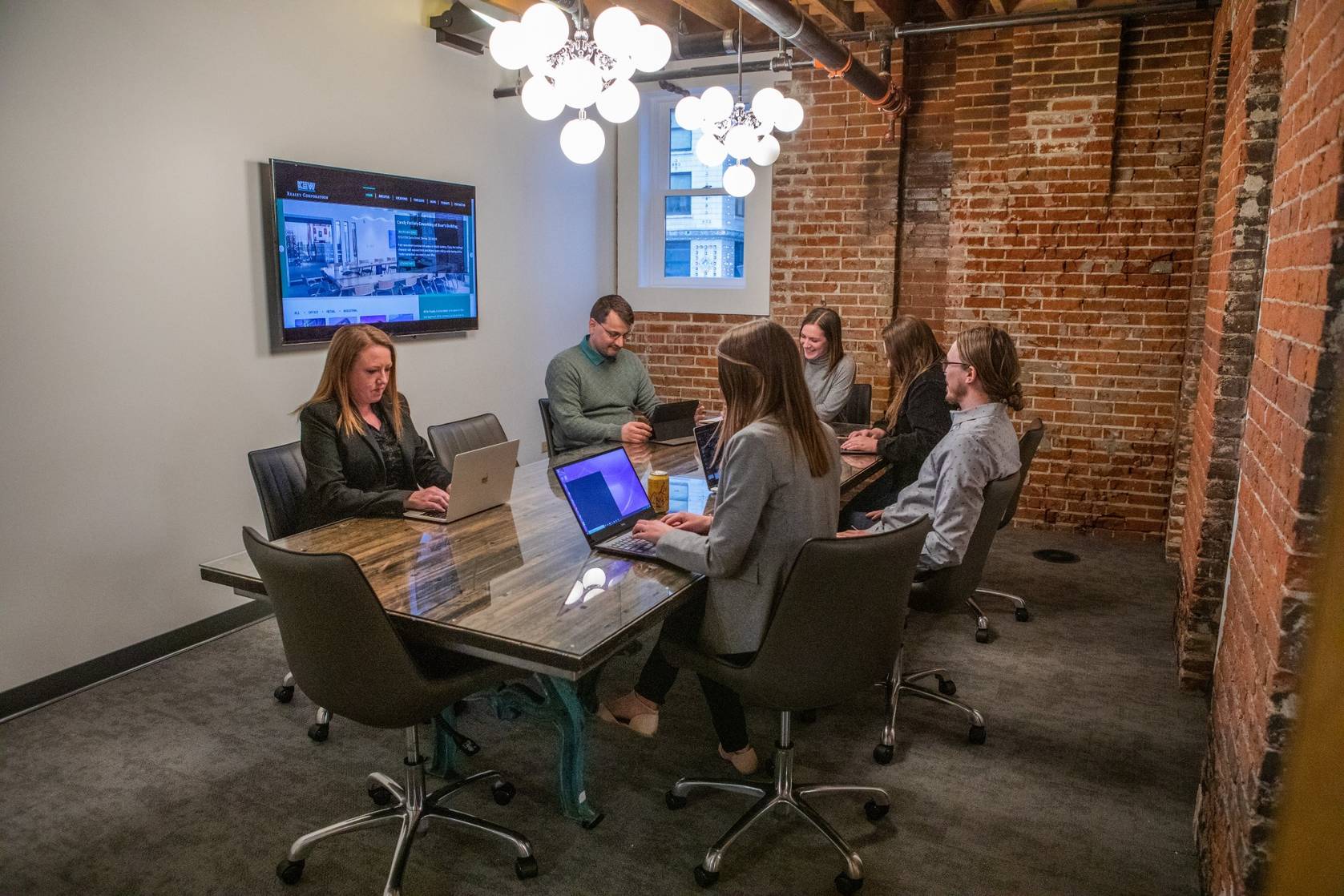 Denver event planners coordinating a professional meeting venue layout