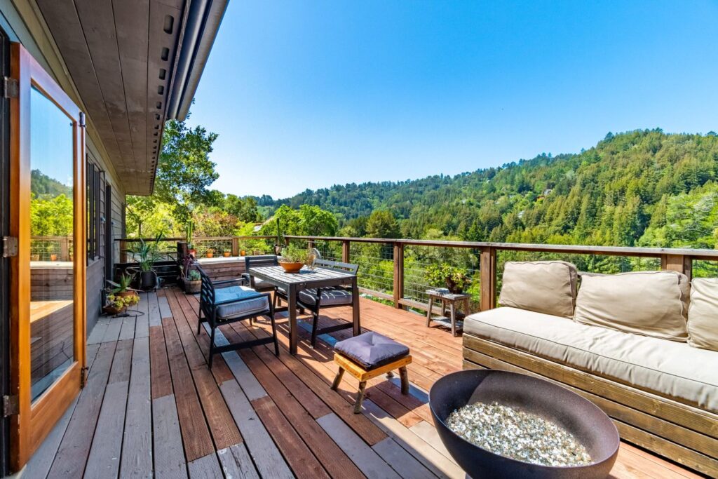 an outdoor deck overlooking a forest