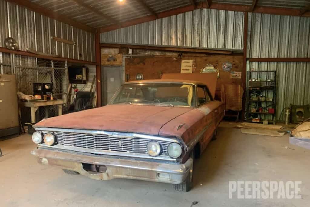 A rustic garage space with a classic car 