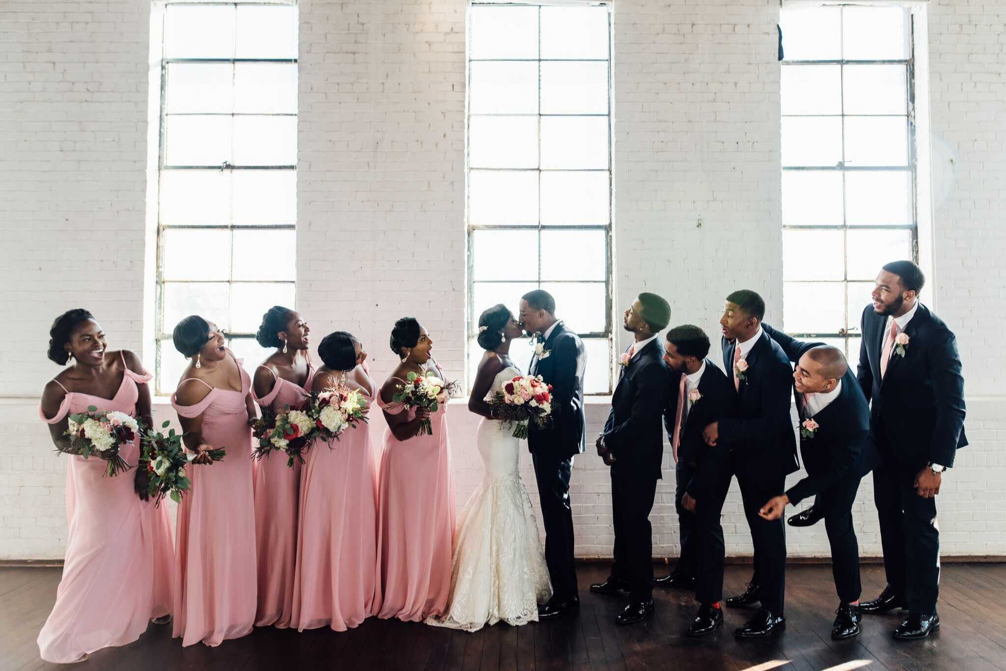 Newlyweds celebrating their Nigerian wedding in Houston surrounded by joyful family