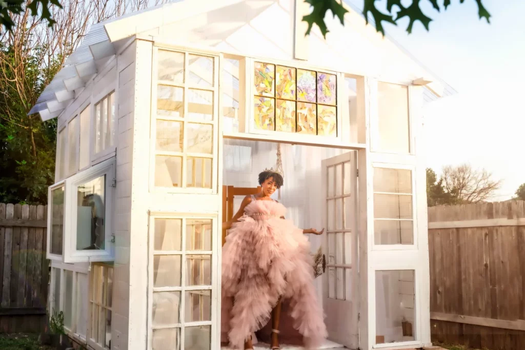 an all-white mini greenhouse in austin