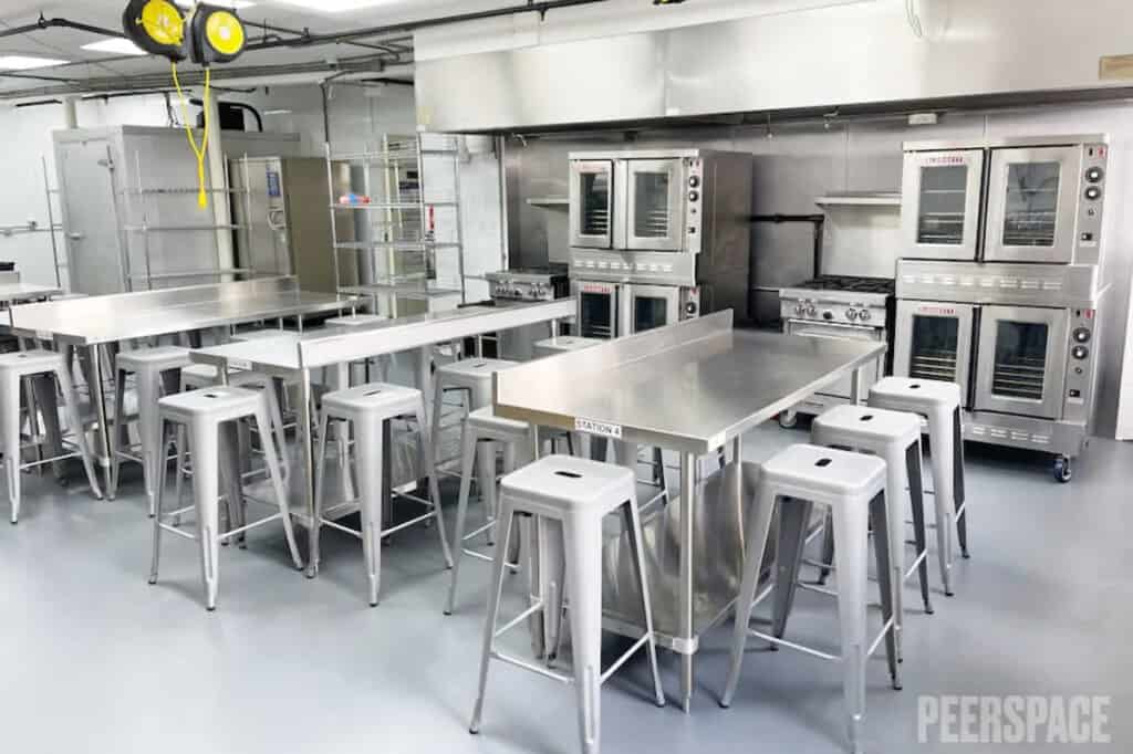 Commercial Kitchen With Loads of Light and Stainless Steel Appliances