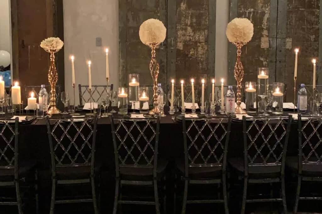 a dinner party set up in an industrial loft