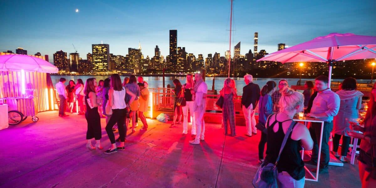 people at an outdoor party with neon lights