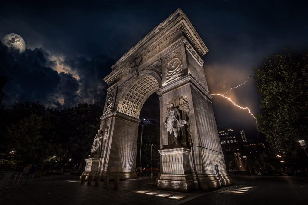Spooky image of an arch with storm clouds and lightening behind it