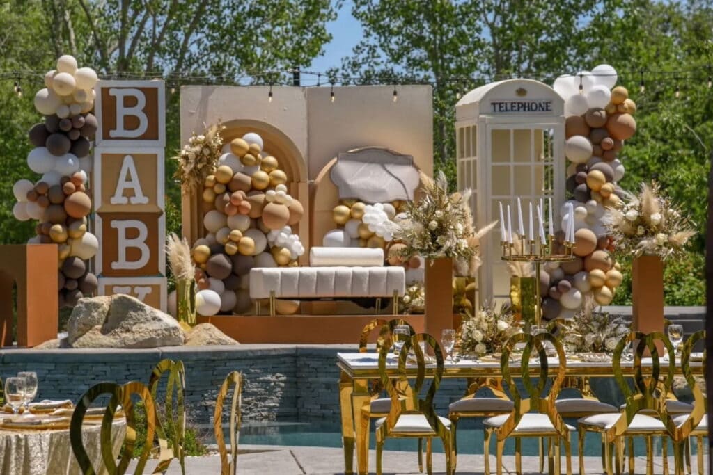 Lavish outdoor baby celebration with gold accents