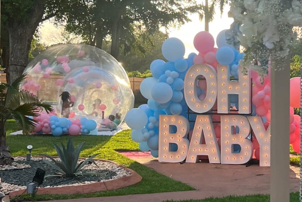 gender reveal decor at an outdoor party venue
