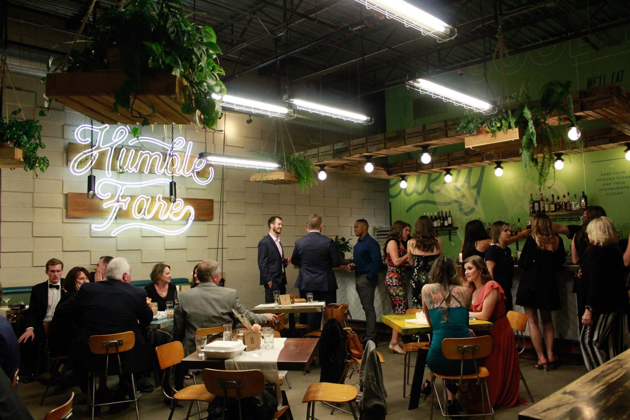 Guests mingling in a stylish industrial-chic party venue in Atlanta