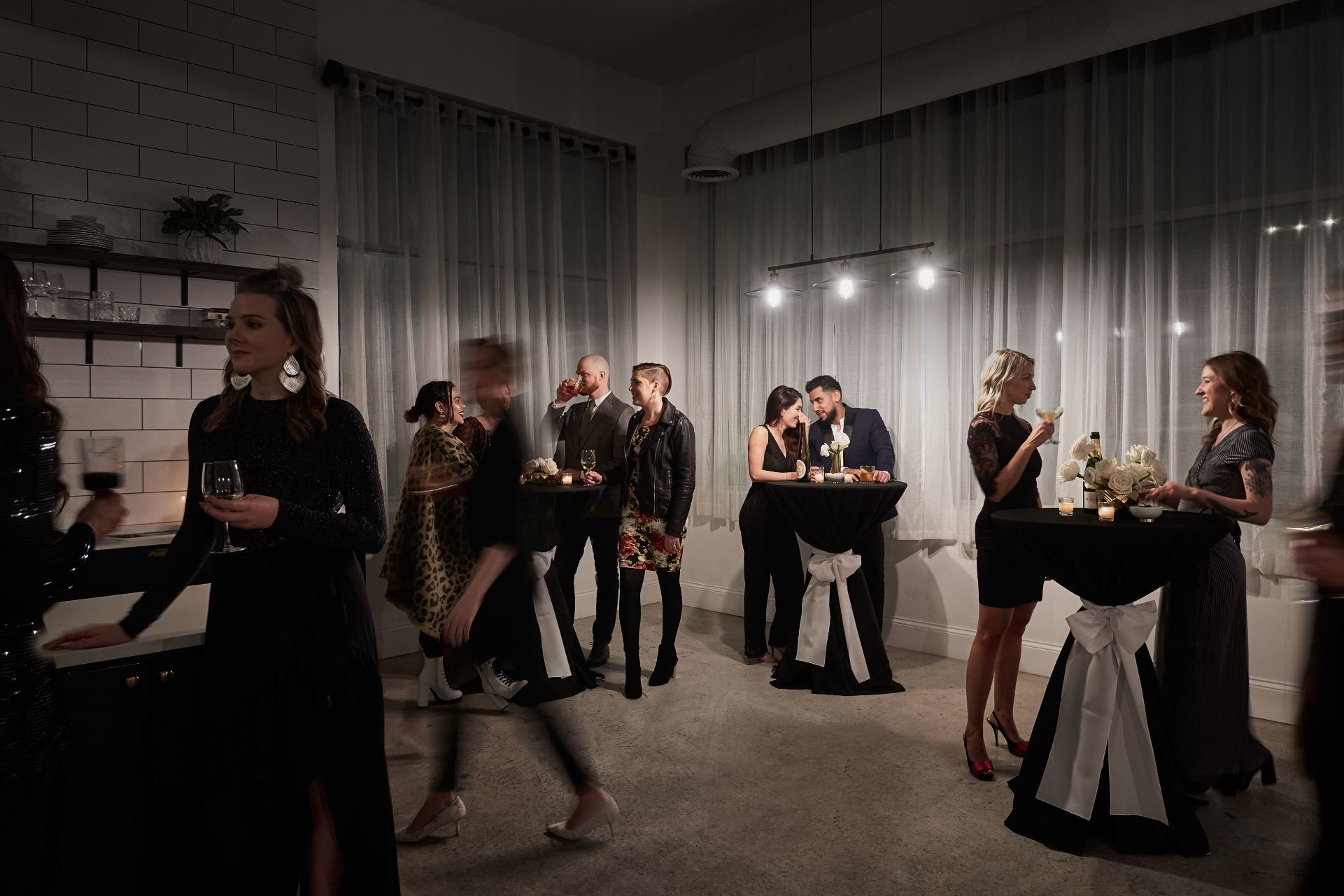 Well-dressed guests socializing at a sophisticated Atlanta party event