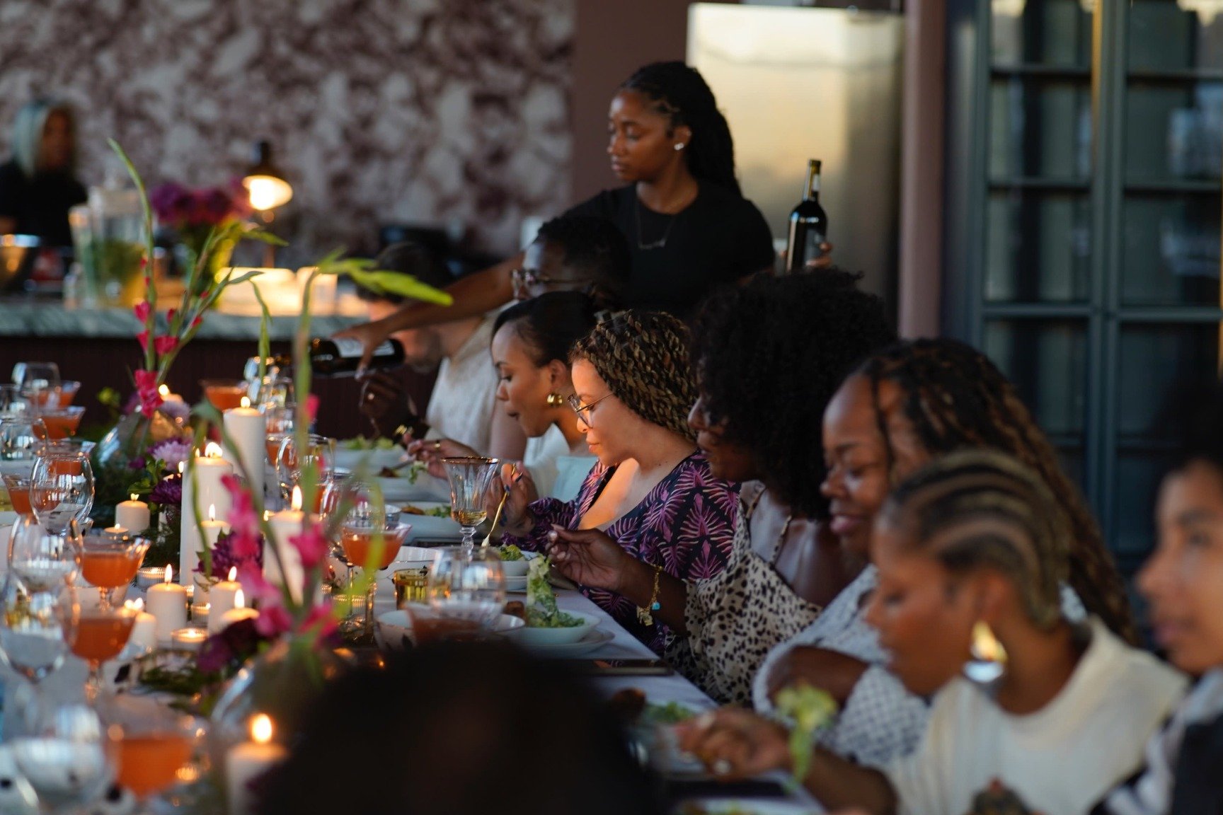 Baltimore party planners arranging floral centerpieces for a festive event