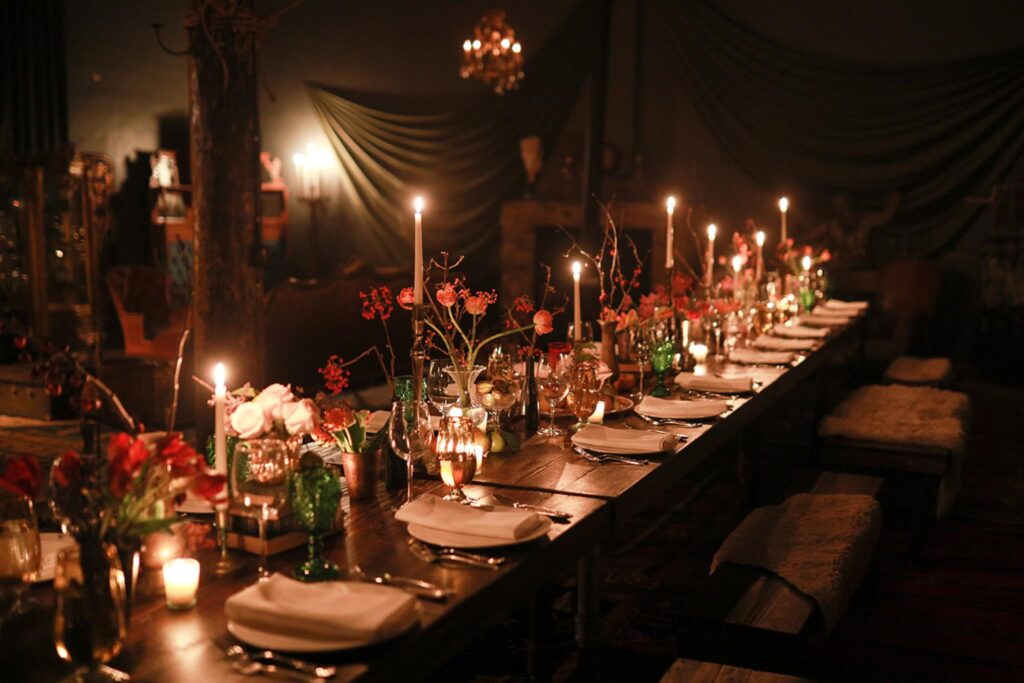 Moody lighting with romantic tablescape designed by Chicago party planner