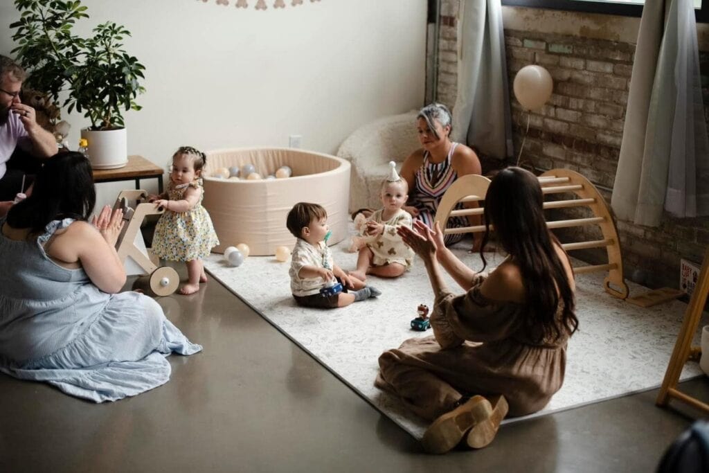 Women and young children at birthday party decorated room put on by Chicago party planner