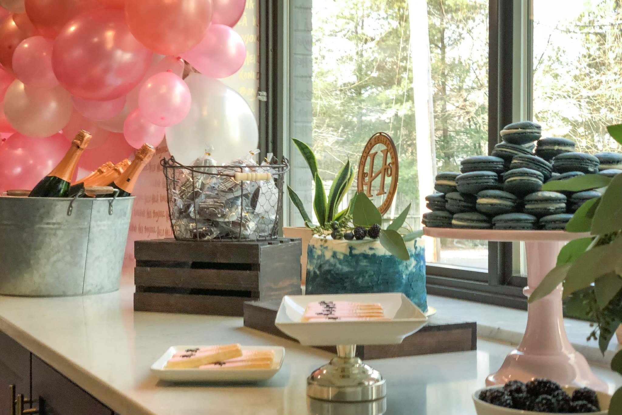 Cincinnati celebration display with balloons, champagne, and dessert styling