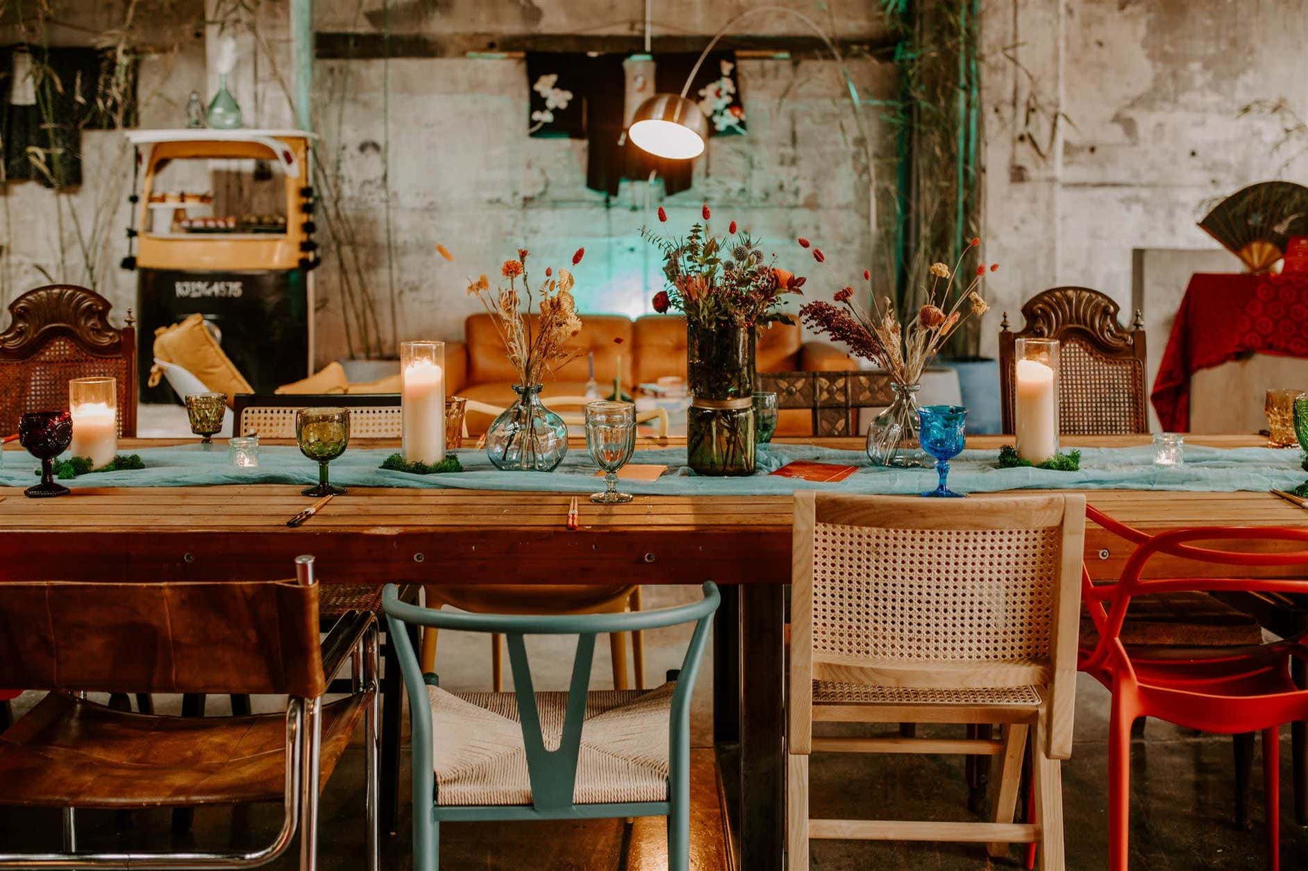 Styled Cincinnati dinner table with candles, florals, and eclectic decor