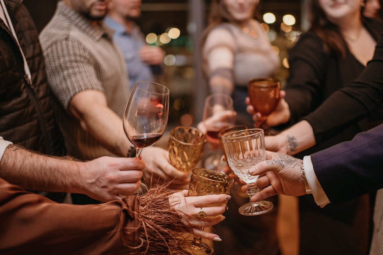 Guests toasting with drinks at a festive Kansas party