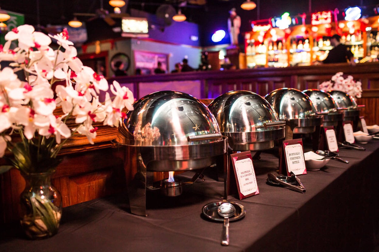 Party planners in Louisville arranging refined décor details for an event