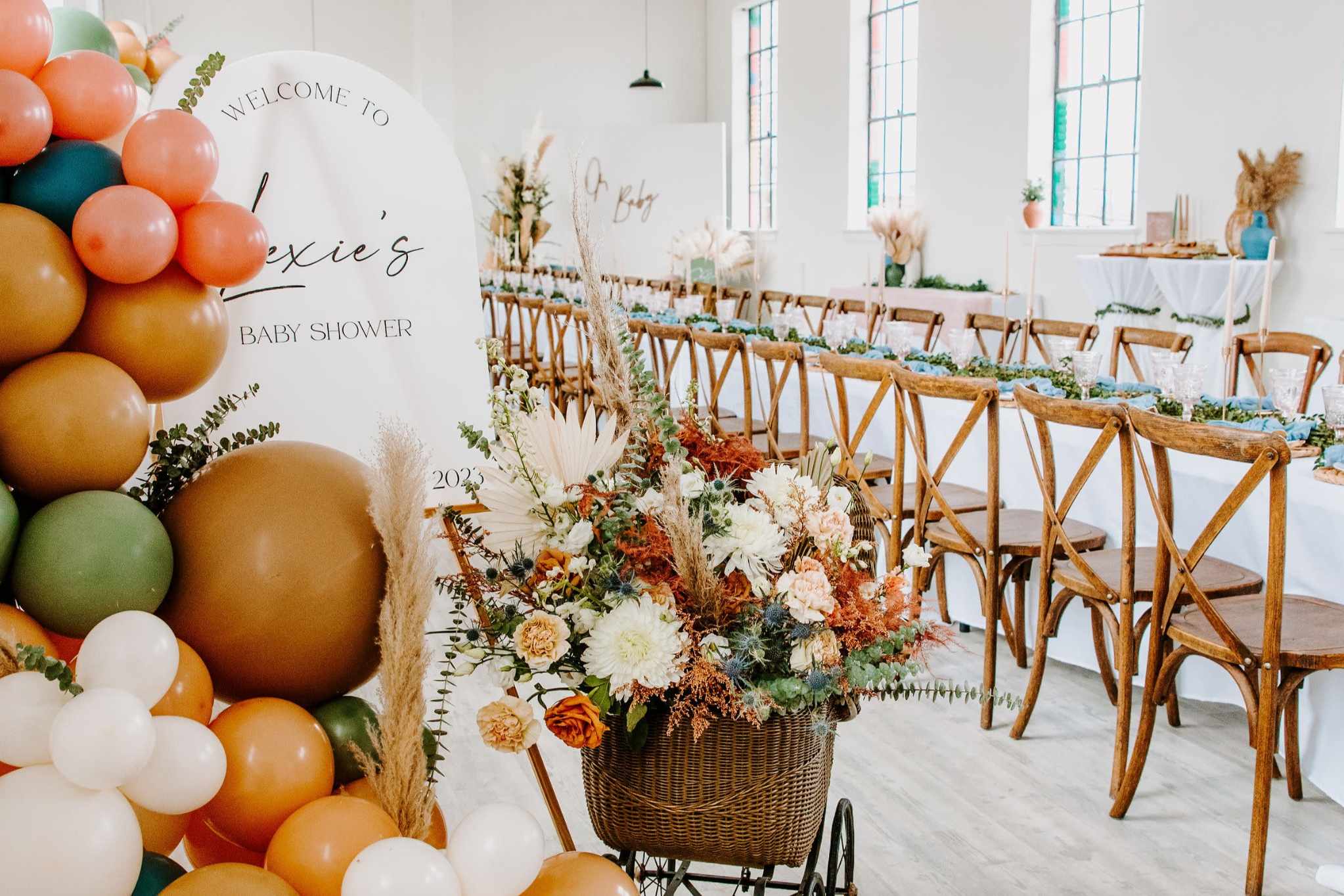 Styled baby shower with balloon installation and floral décor in Maryland