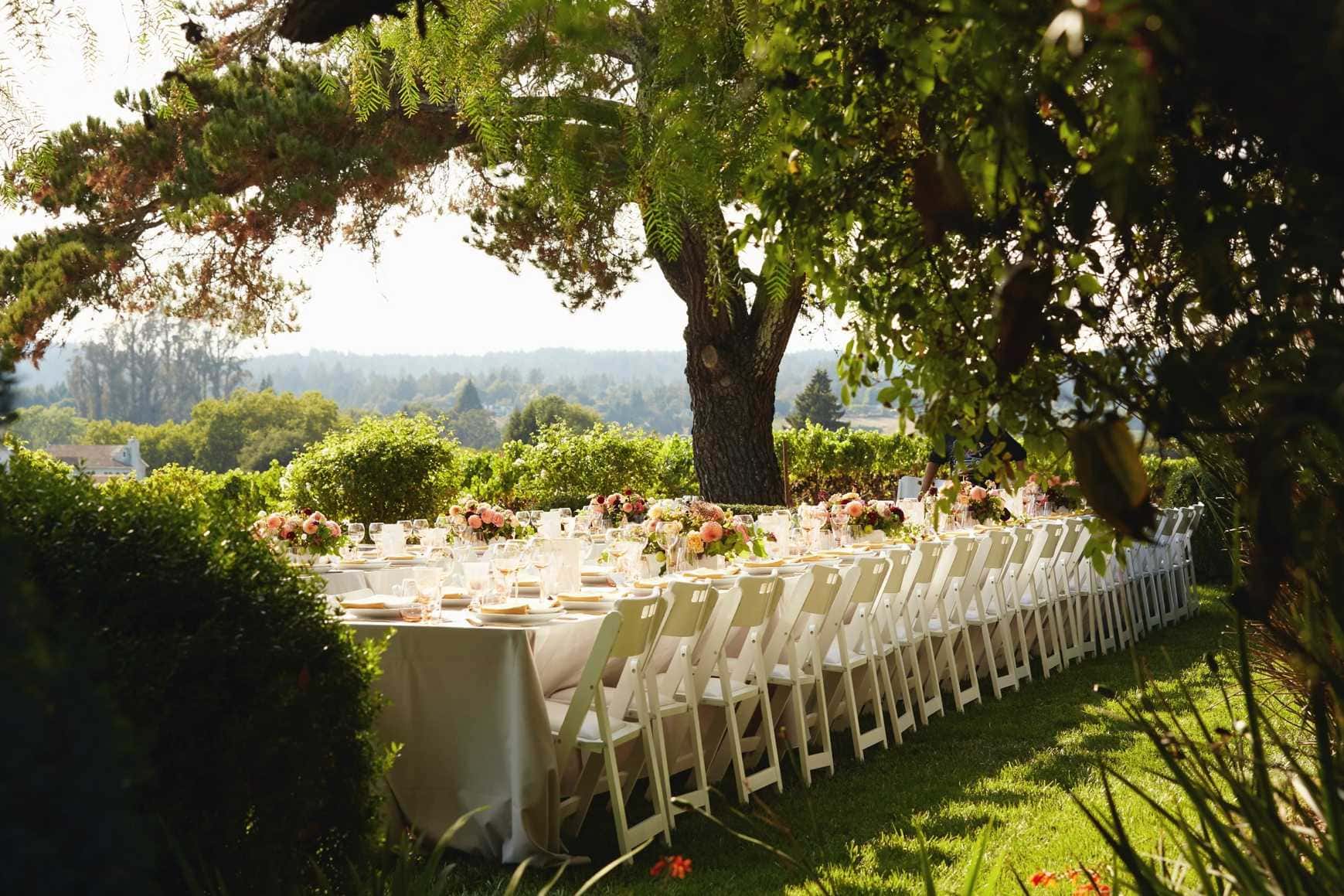Elegant outdoor reception tablescape with floral centerpieces in Sacramento