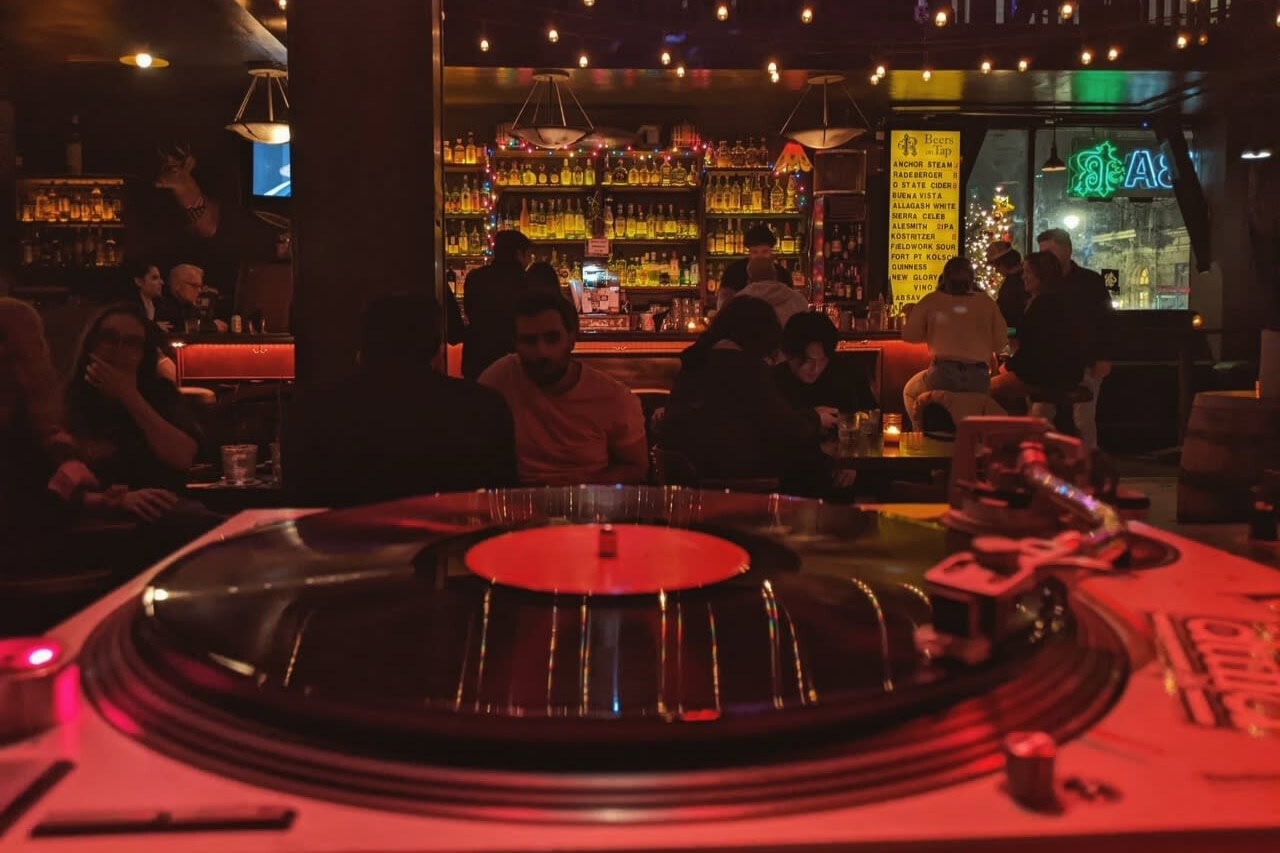 San Francisco nightlife party venue with DJ turntable and bar