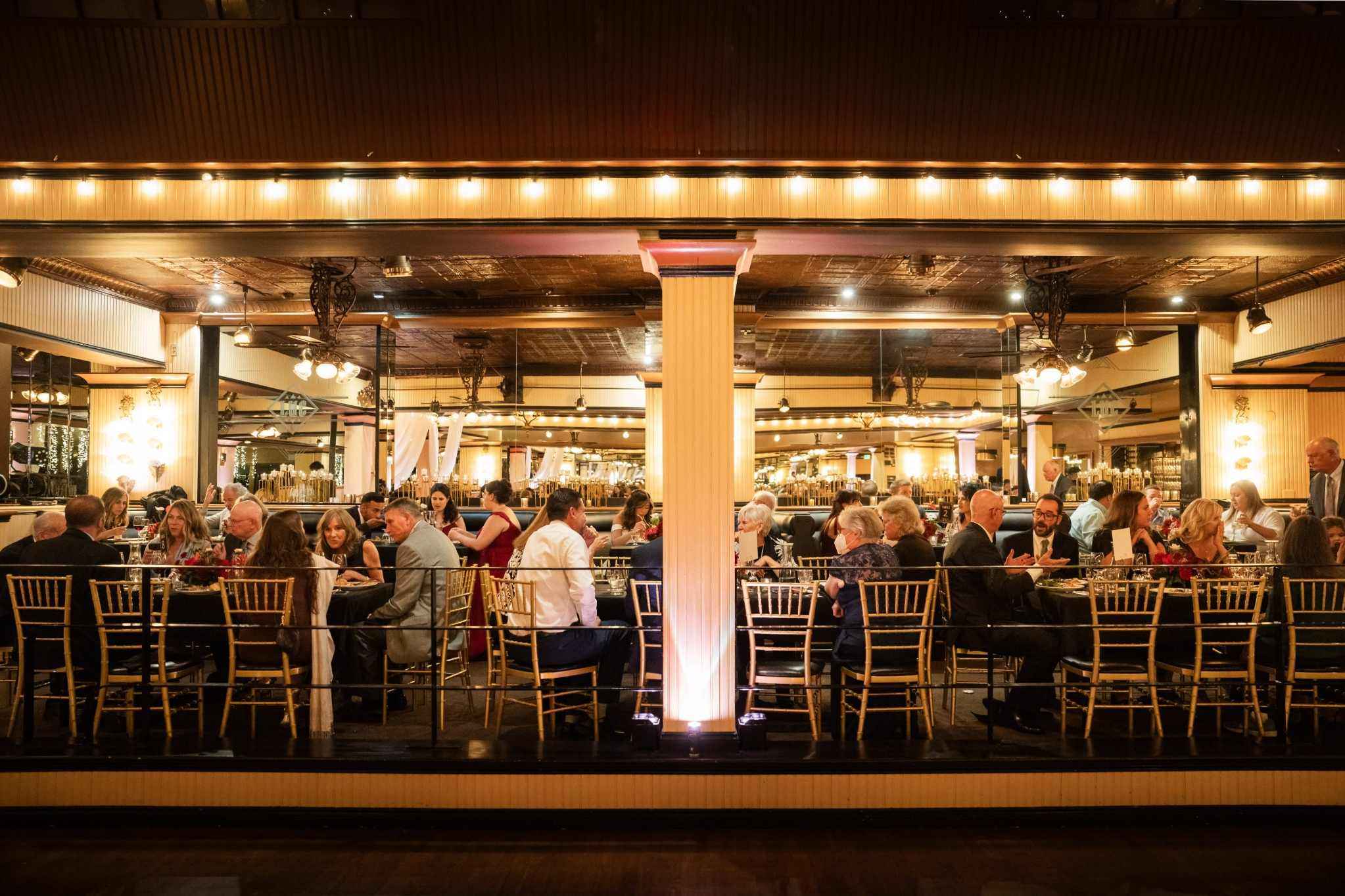 Large formal Seattle event venue with seated guests and warm lighting
