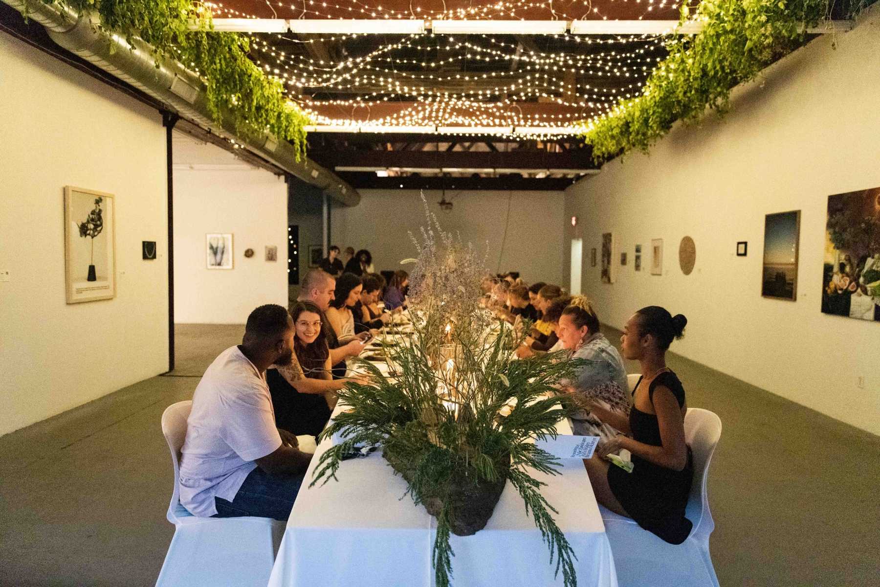 Intimate St Louis gallery dinner with string lights