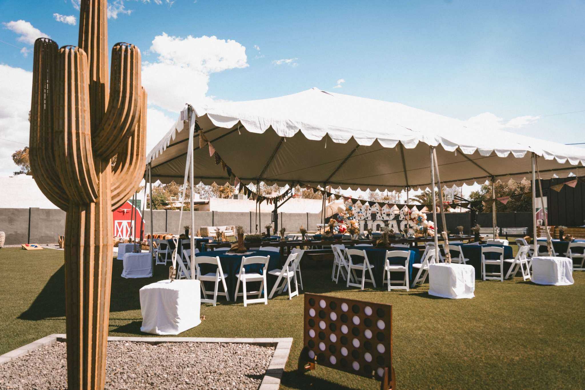 Outdoor desert party venue in Tucson with saguaro and tent