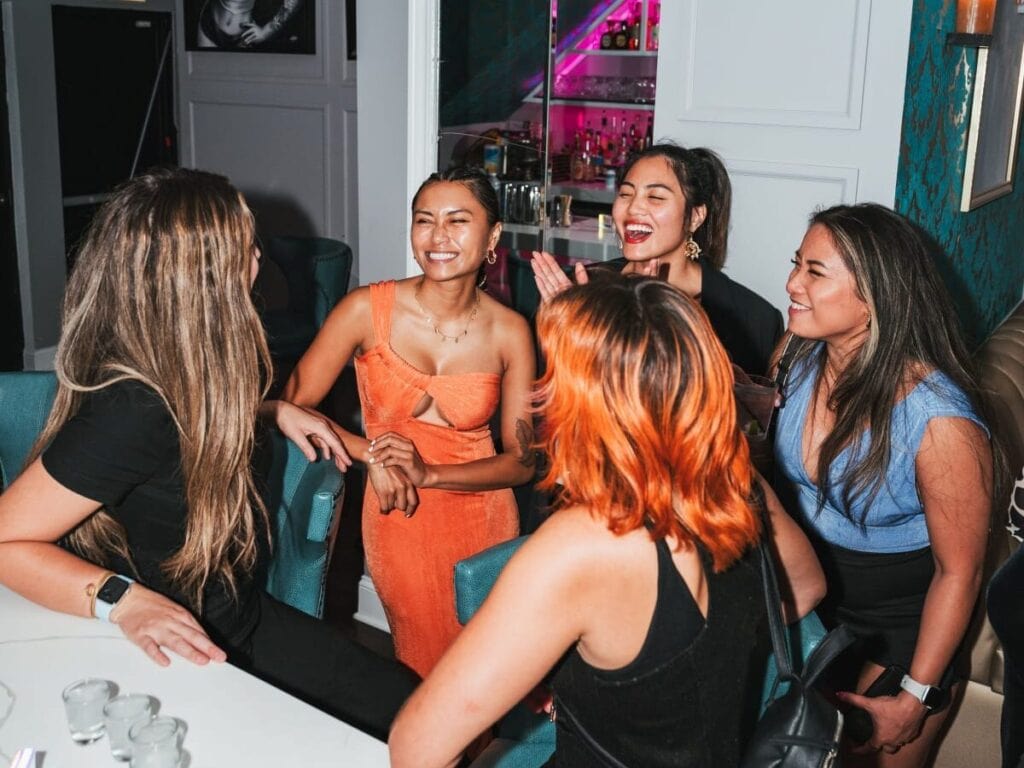 Friends talking in a circle at a Peerspace divorce party venue