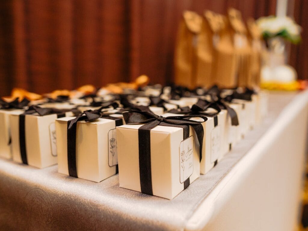 Black and white gift box Friendsgiving party favors on a table