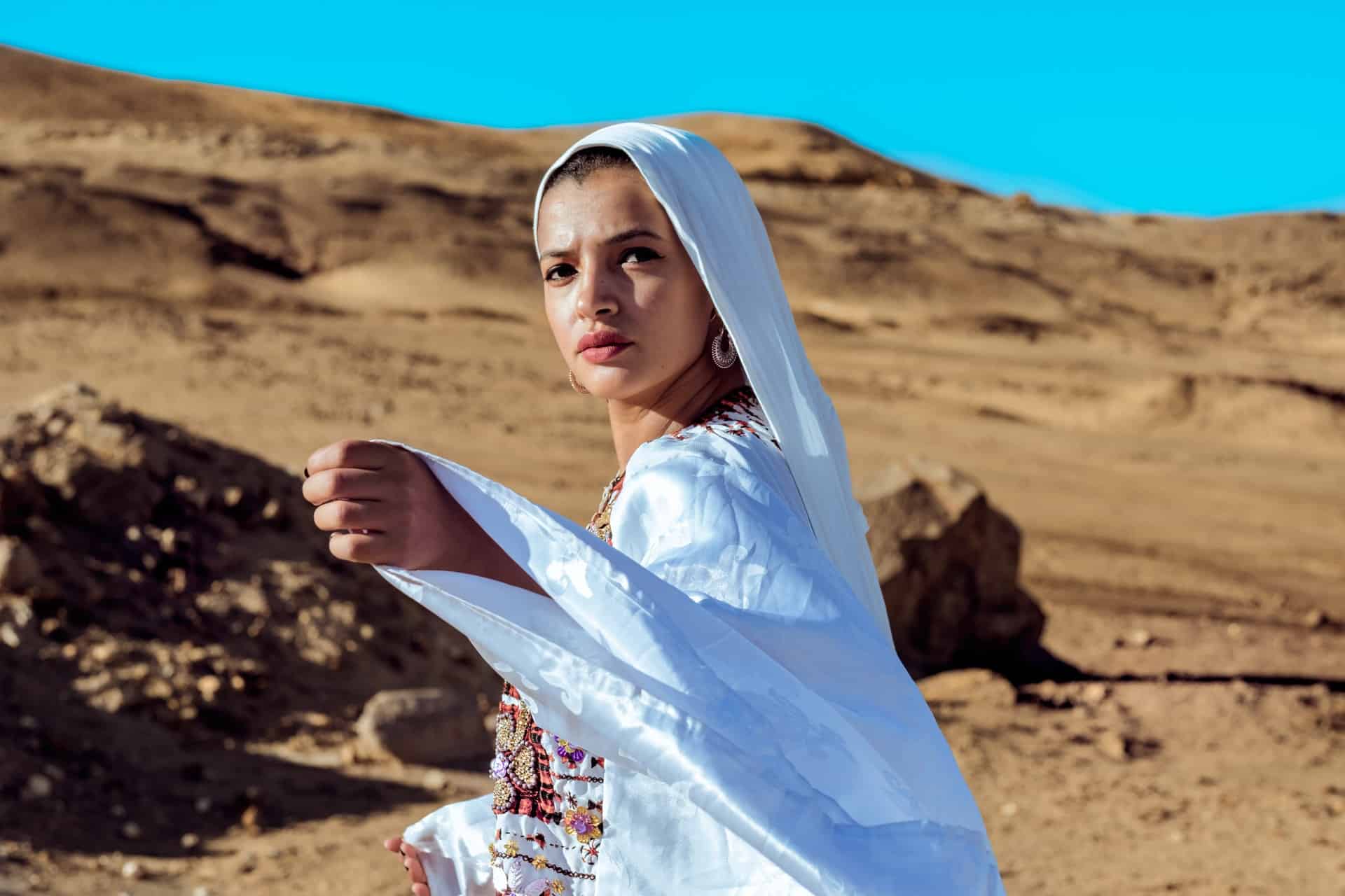 woman wearing white in the desert