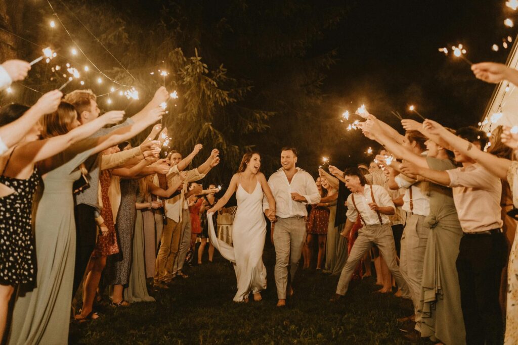 Small wedding reception couple exiting with sparklers