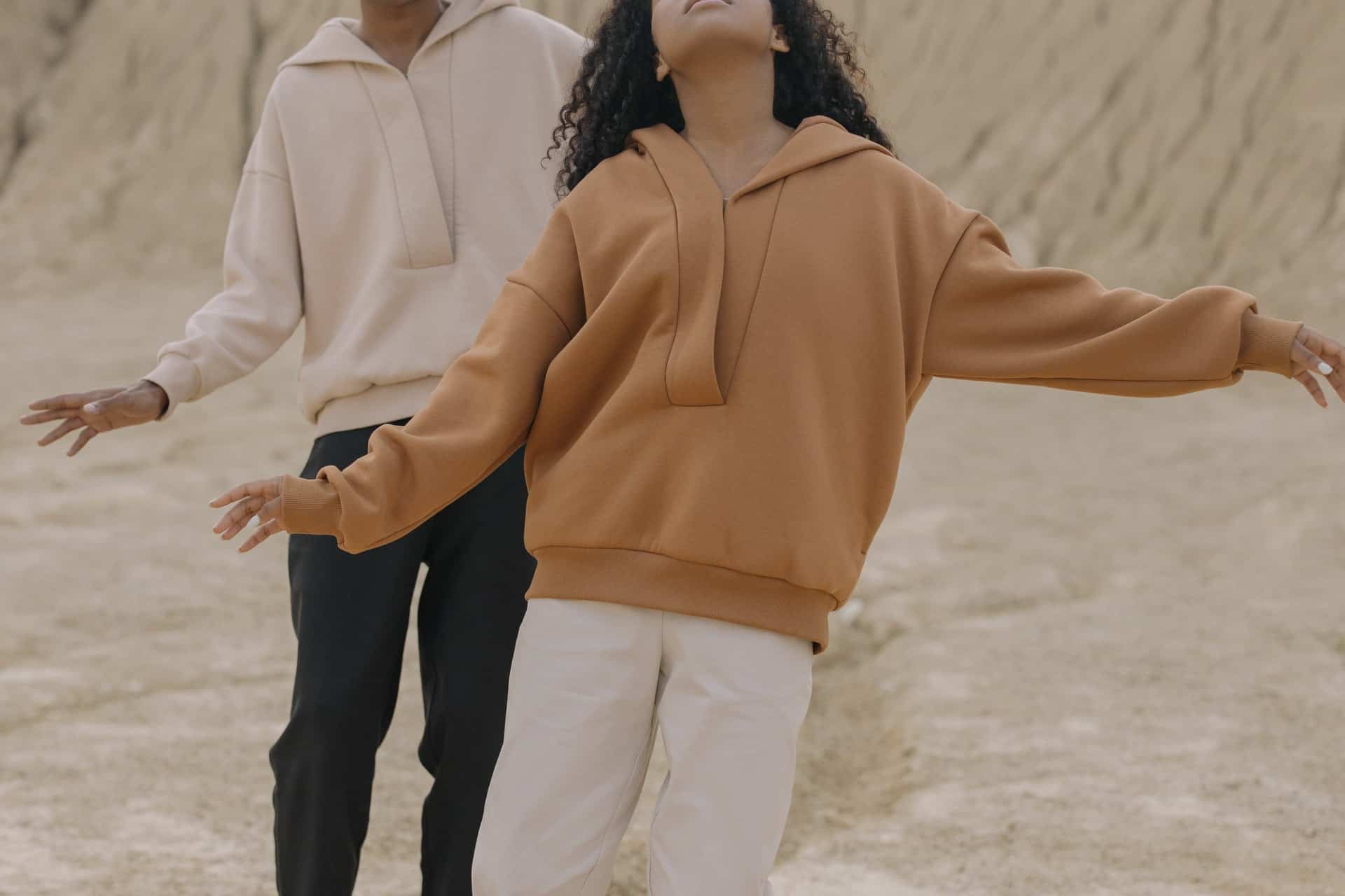 woman and man wearing sweaters