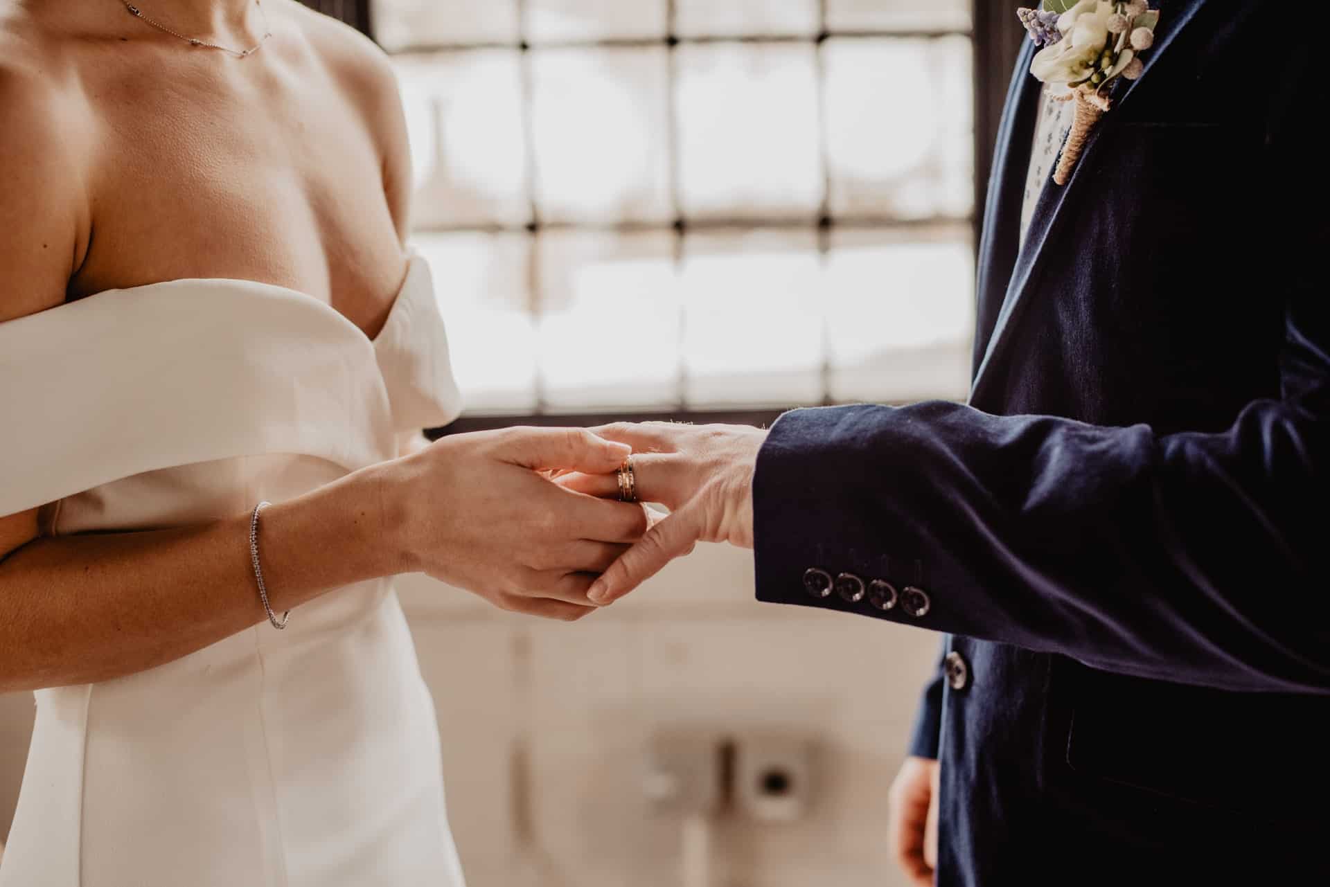 bride and groom holding hands