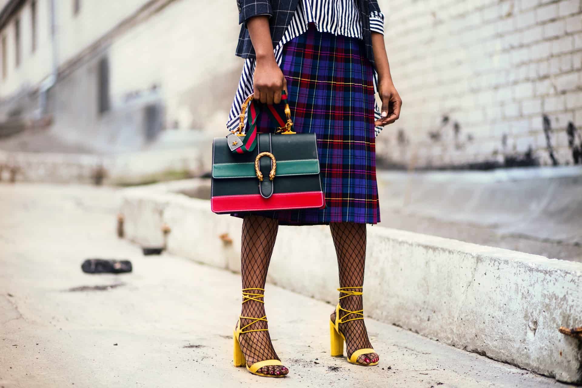 woman in skirt with bag
