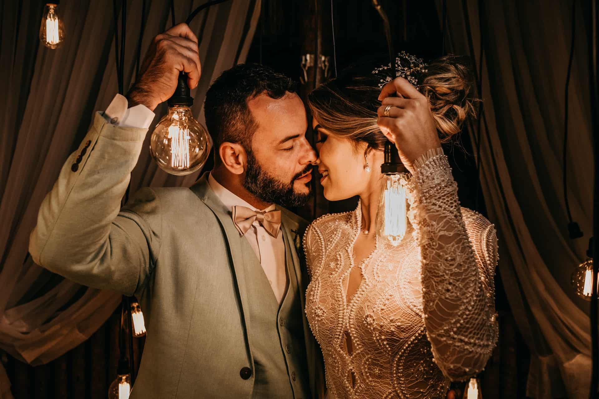 bride and groom holding lanterns