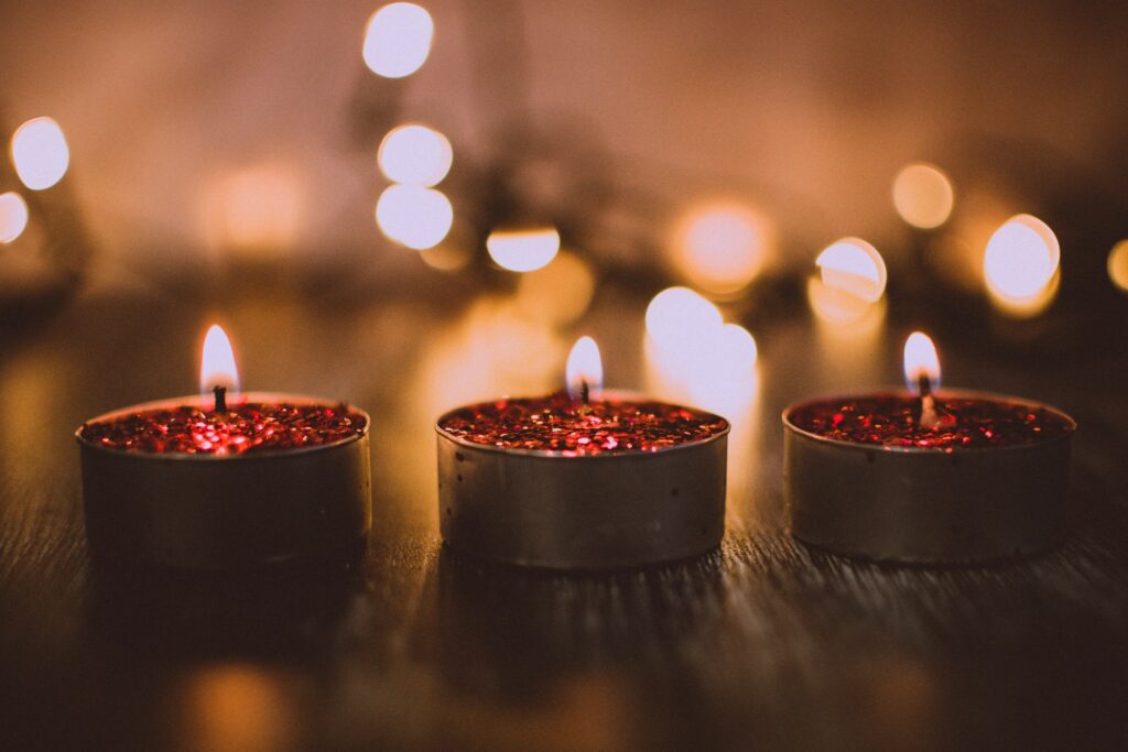 small burning candles on a table