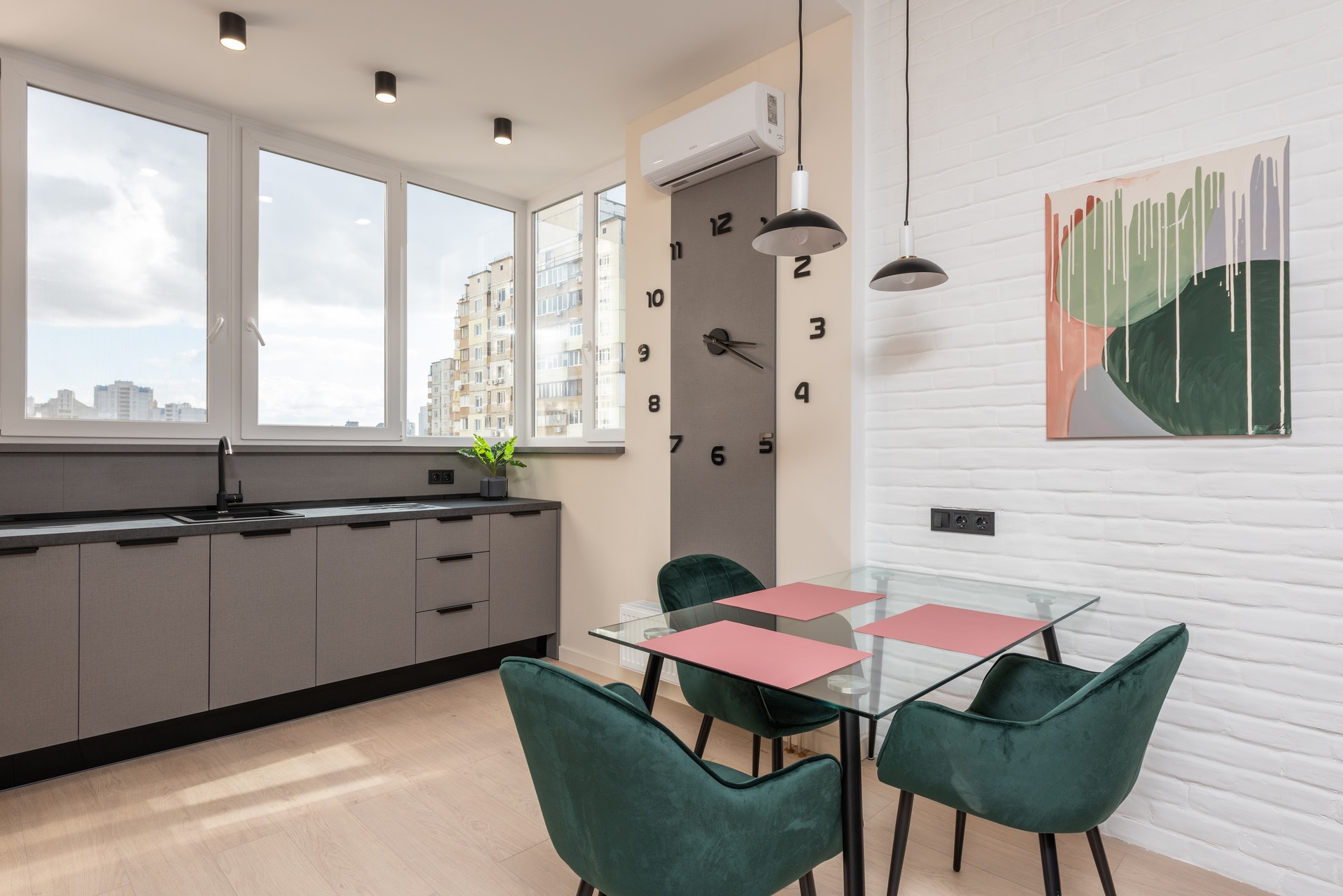 loft kitchen with green chairs