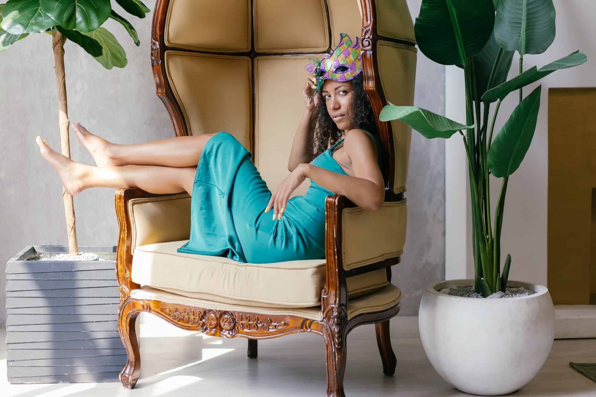 woman in blue dress sitting on chair