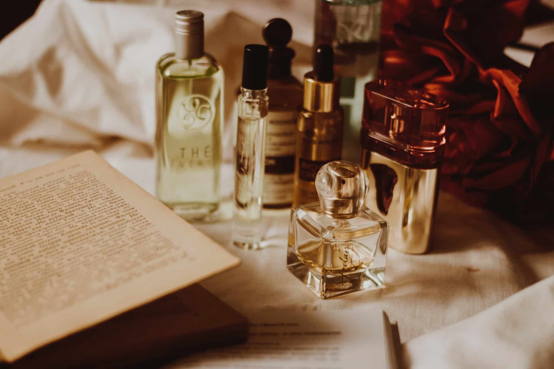 perfume bottles next to book