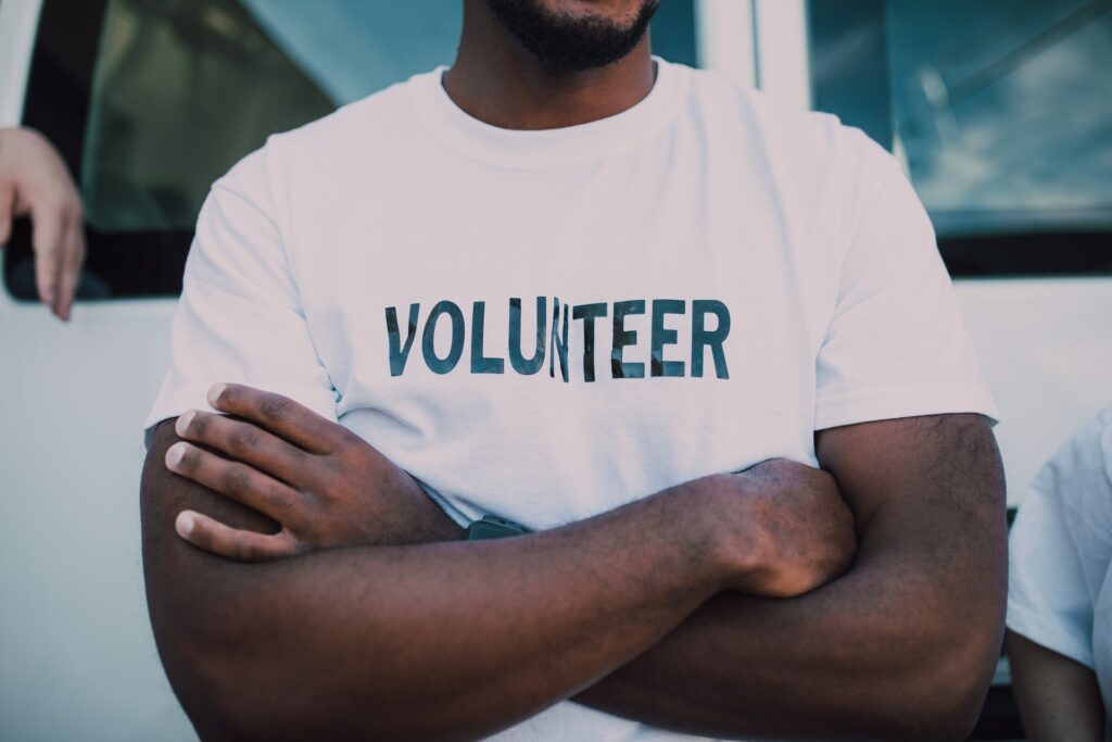 man wearing volunteer shirt