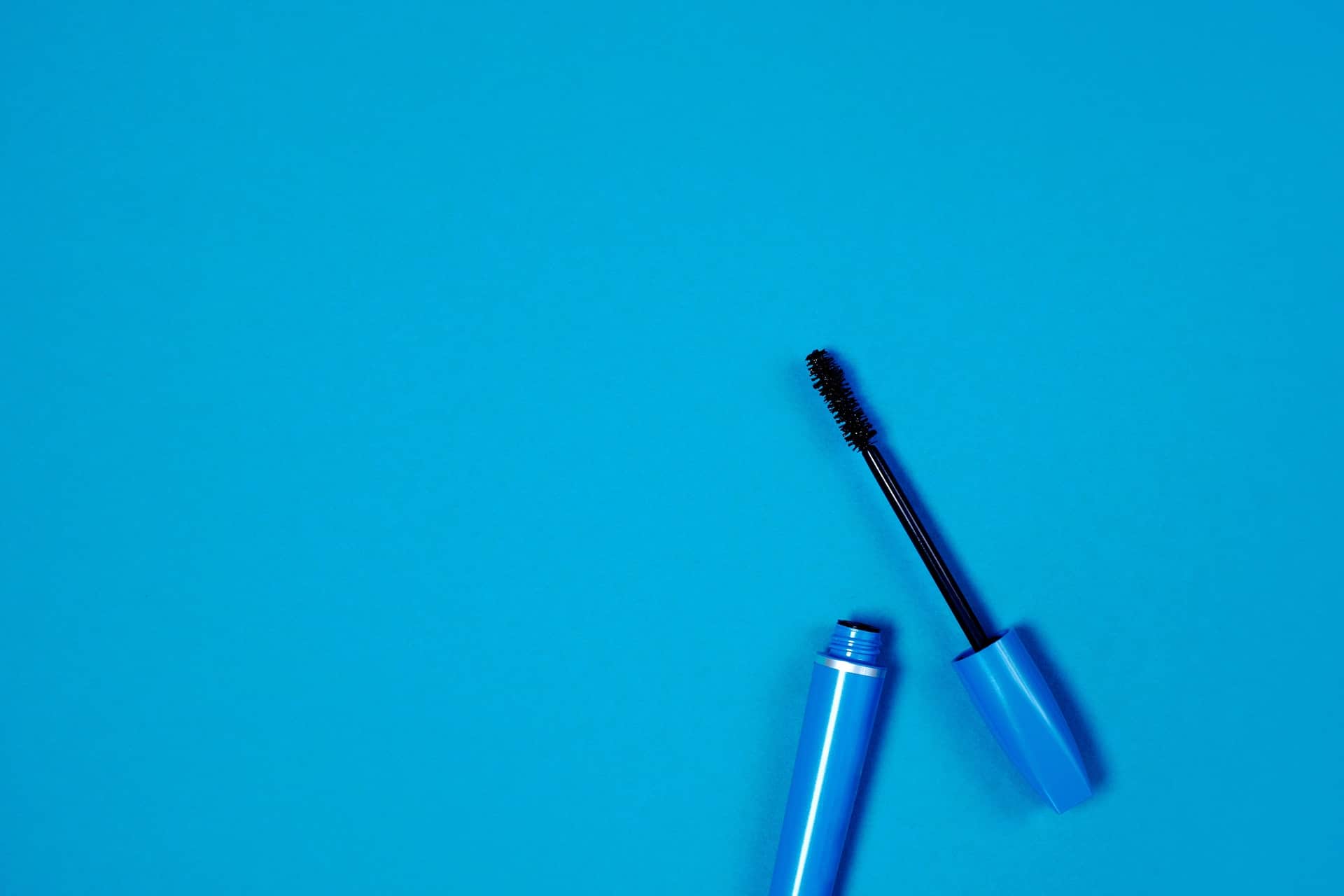 mascara against a blue background