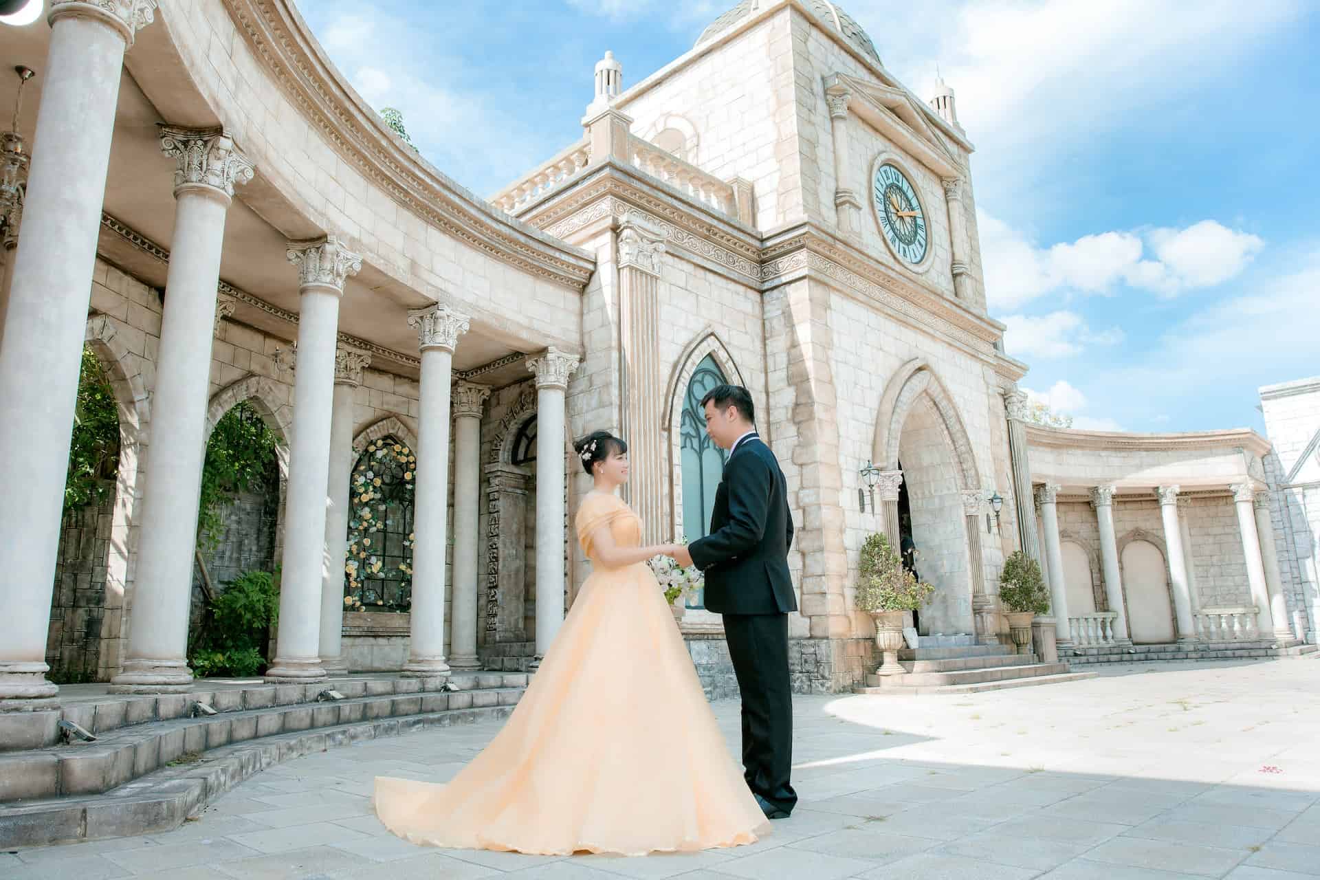 bride and groom holding hands outdoors