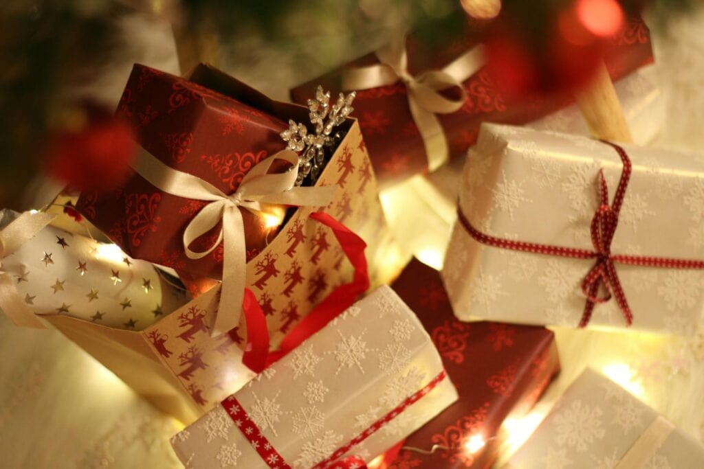 Assortment of wrapped gifts for Christmas gender reveal party