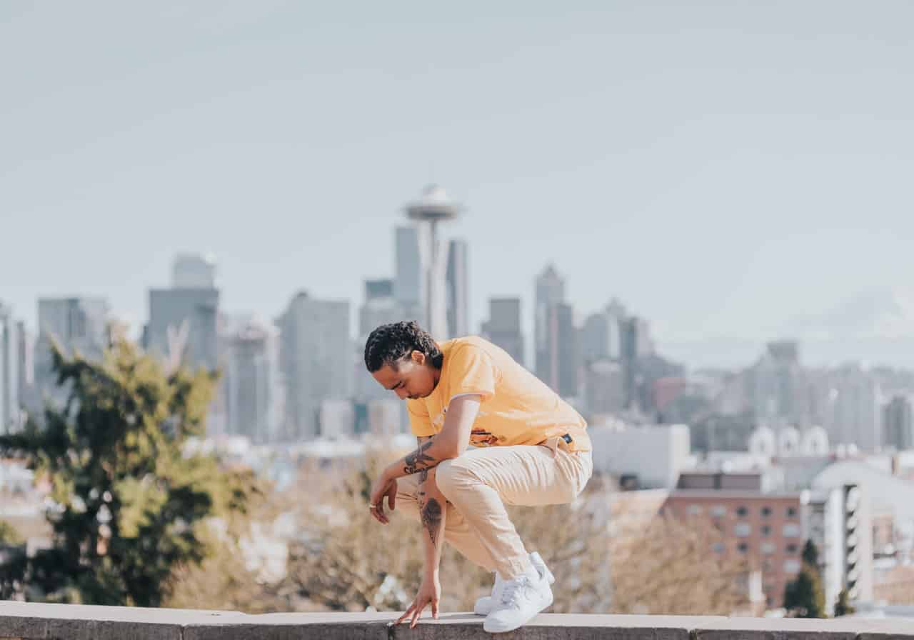 man in front of seattle skyline