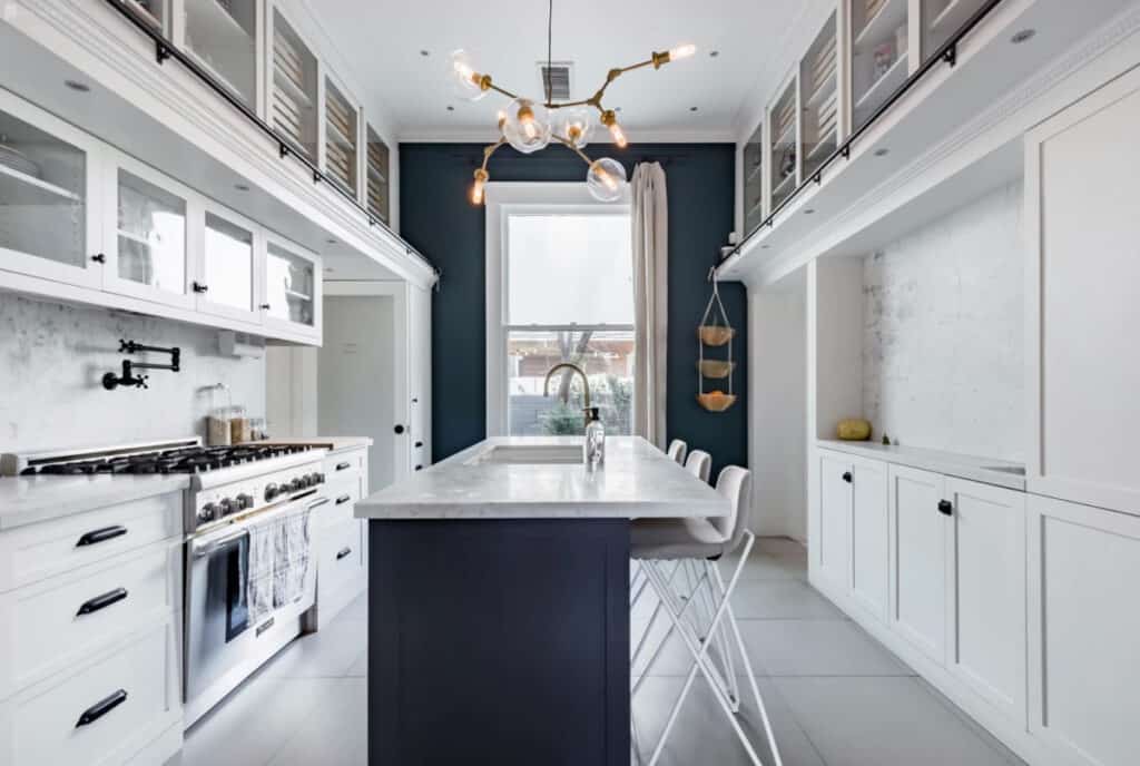 historic cottage with a blue, silver and copper modern kitchen